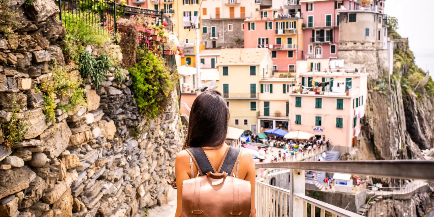 Tourist exploring colorful coastal village in Campania, Italy