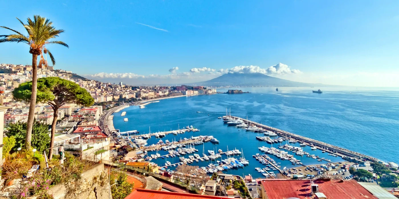 A panoramic view of Naples with Mount Vesuvius in the background