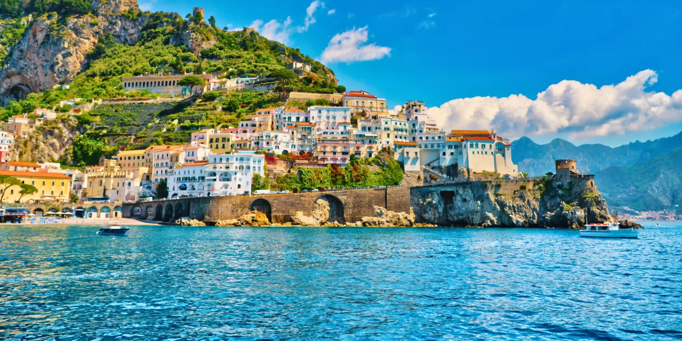 Picturesque view of Amalfi Coast with colorful buildings and clear blue sea