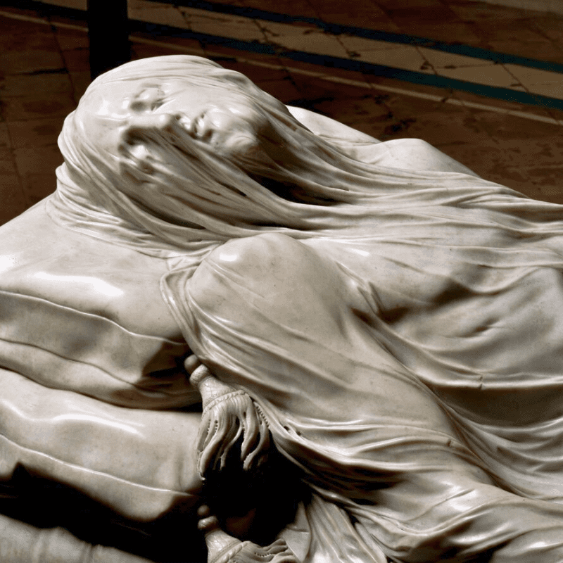 Close-up of the Veiled Christ sculpture in Cappella Sansevero, Naples, showcasing its intricate marble artistry.