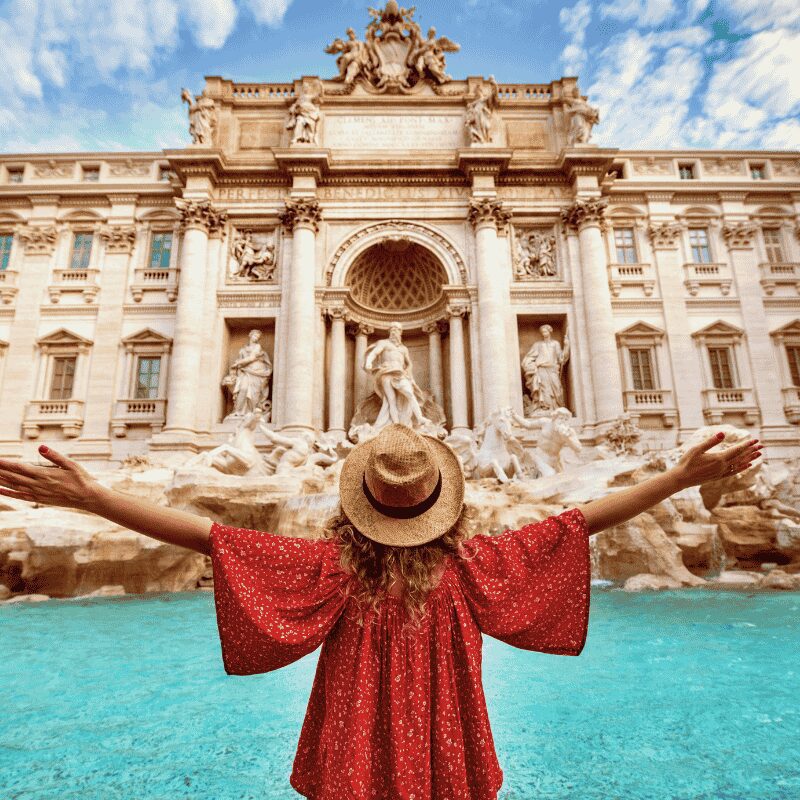 Tourist in front of Trevi Fountain in Rome, Italy, experiencing Lazio tours.