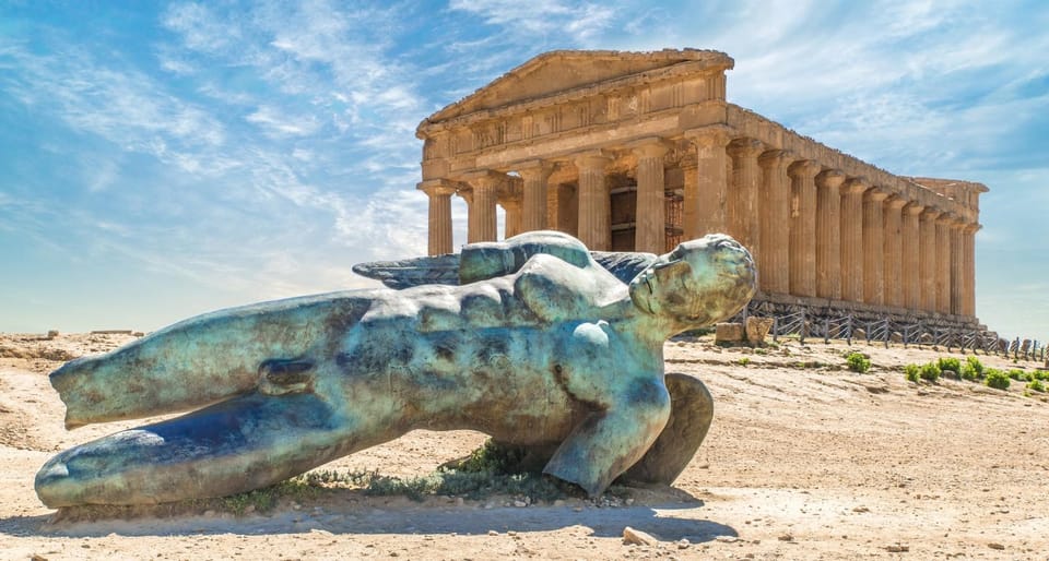 Iconic Fallen Icarus bronze statue in front of the Temple of Concordia, Valle dei Templi in Agrigento.
