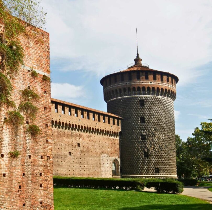 Milan Castle’s round defensive tower with blue sky in background
