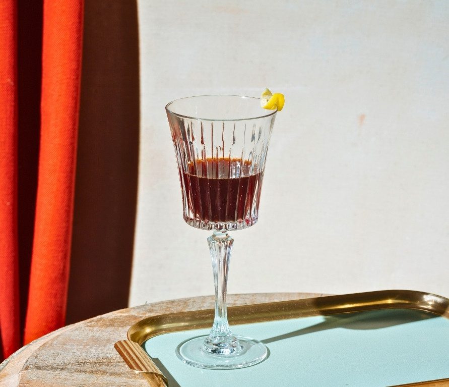 Glass of Vermouth served in historic café on Turin Food Tour