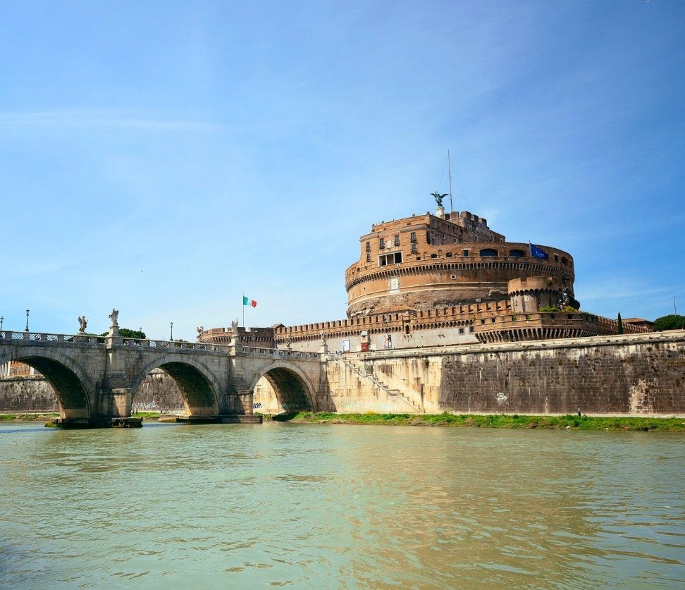 Castel Sant’Angelo and Ponte Sant’Angelo reflected in the Tiber River during a guided tour