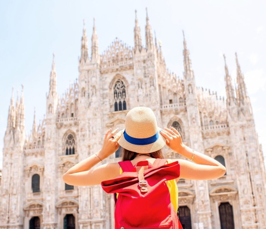 Female tourist enjoying the Milan Cathedral Tour while admiring the Duomo