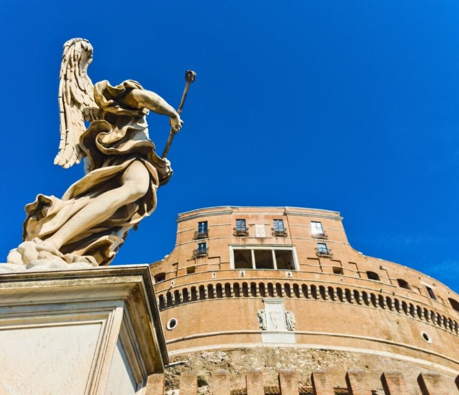 Angel statue on Ponte Sant’Angelo with Castel Sant’Angelo in the background