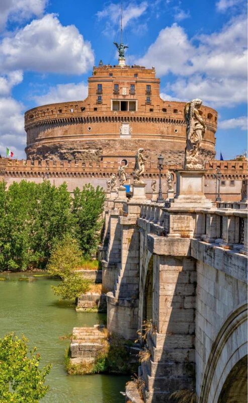 Side view of Castel Sant’Angelo with trees and river, seen during a guided tour