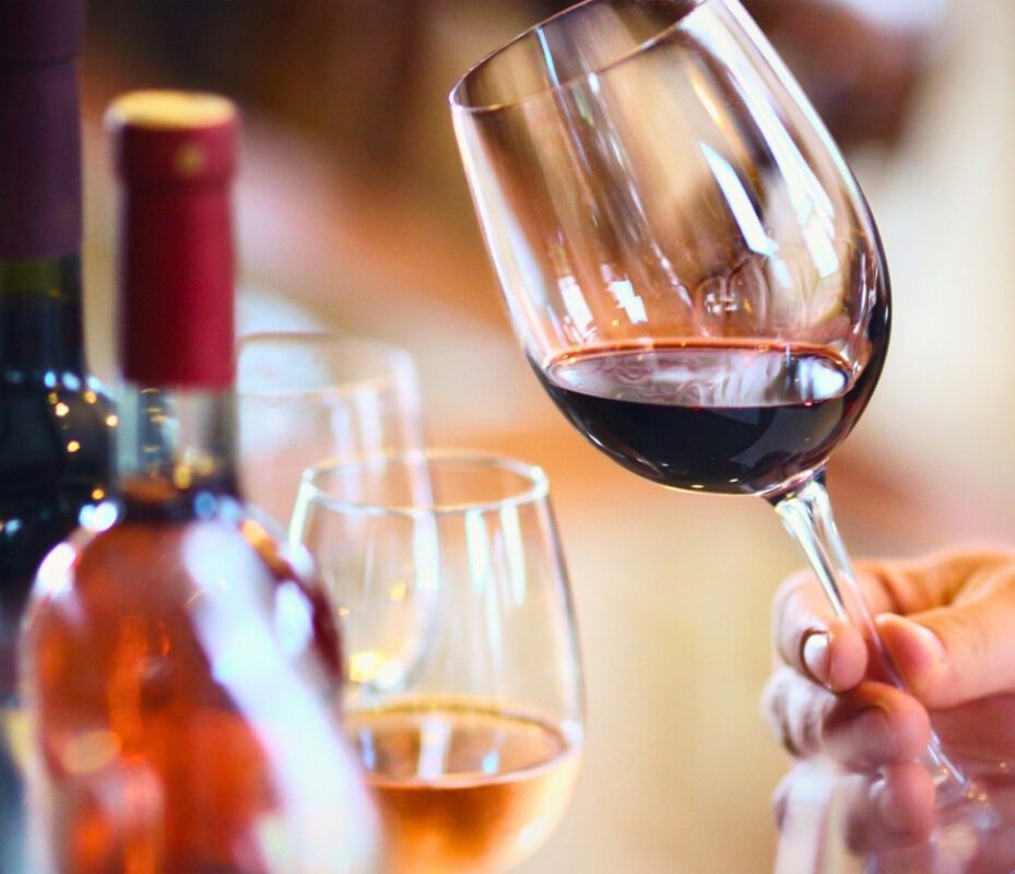 Red wine swirling in glass during Milan Wine Tour