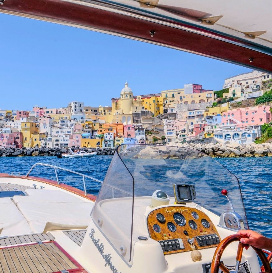 Colorful Marina di Corricella seen from a Procida boat tour departing from Naples